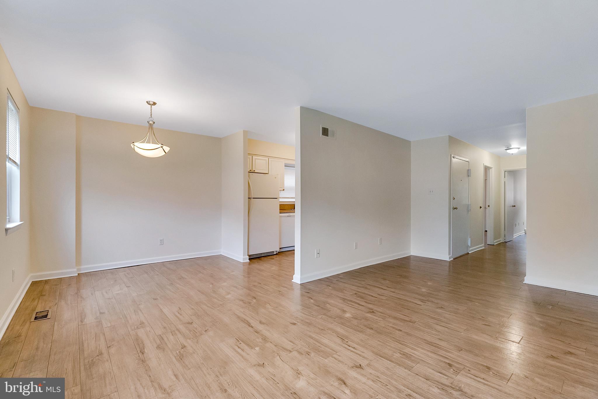 9754 East Roosevelt Boulevard, Unit 1 Philadelphia, PA 19115 - Photo 10 of 30 a view of an empty room with wooden floor and a window