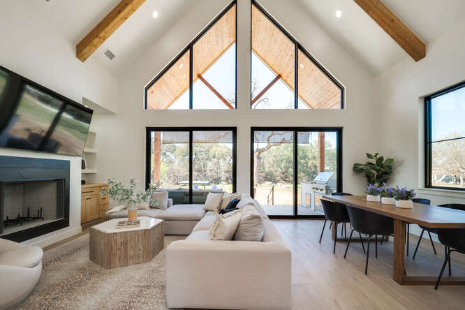 a living room with furniture and a large window