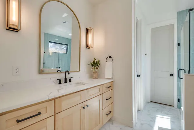 a bathroom with a double vanity sink and mirror