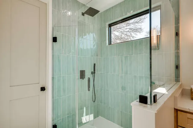 a bathroom with a shower and toilet