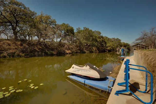 a view of a house with backyard porch and sitting area