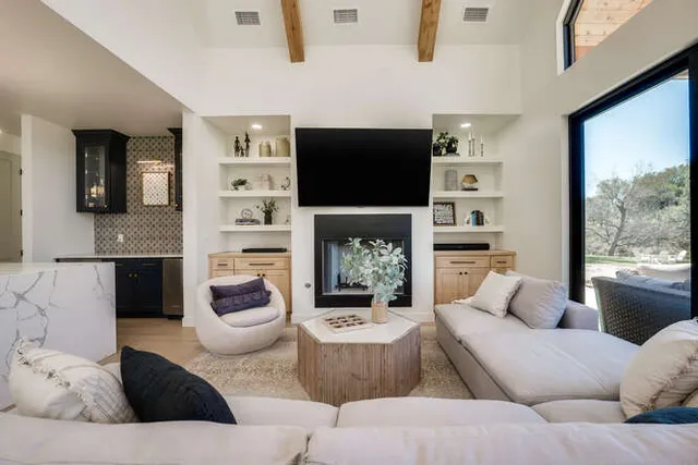 a living room with furniture and a fireplace