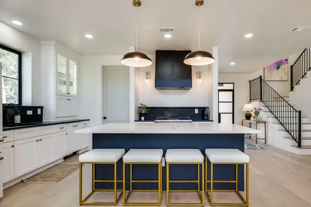 a kitchen with a table and chairs in it