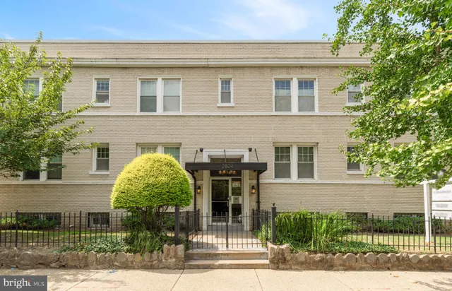 front view of a house with a garden