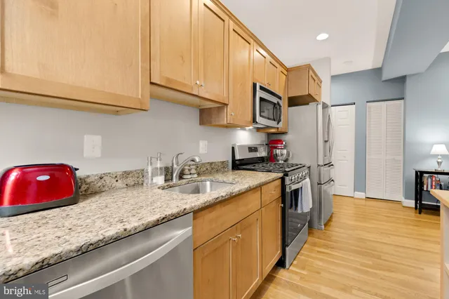 a bedroom with a bed and dresser