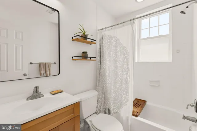 a bedroom with a bed and a chair