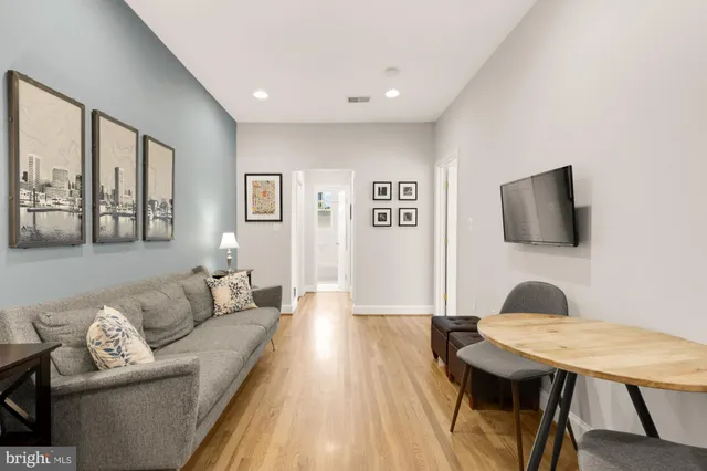 a living room with furniture and a table