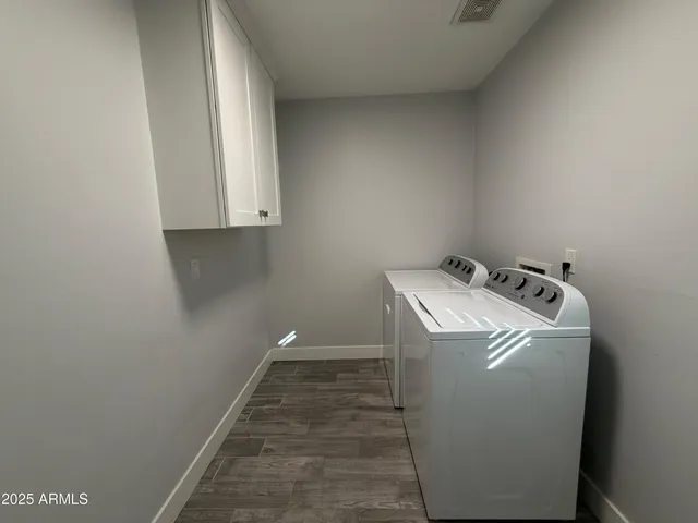 a utility room with dryer and washer