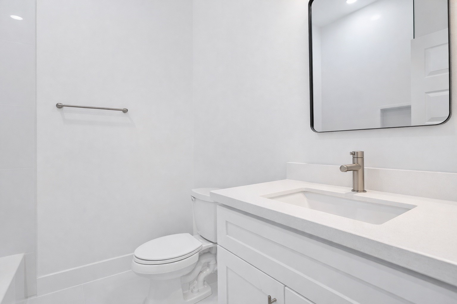 8137 Cabot Street, Unit B Houston, TX 77078 - Photo 12 of 13 a bathroom with a sink a toilet and mirror
