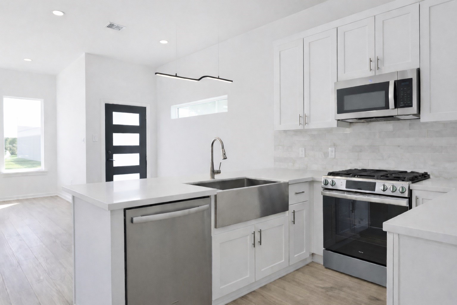 8137 Cabot Street, Unit B Houston, TX 77078 - Photo 4 of 13 a kitchen with white cabinets and appliances