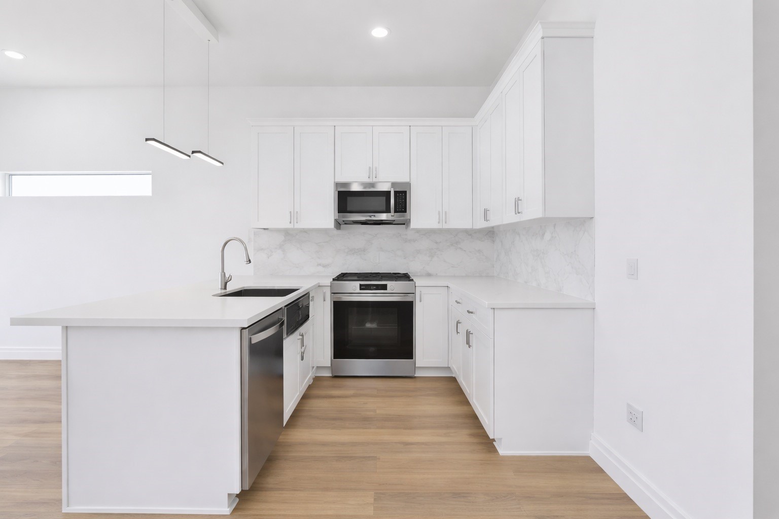 8137 Cabot Street, Unit B Houston, TX 77078 - Photo 5 of 13 a kitchen with a sink and a stove top oven