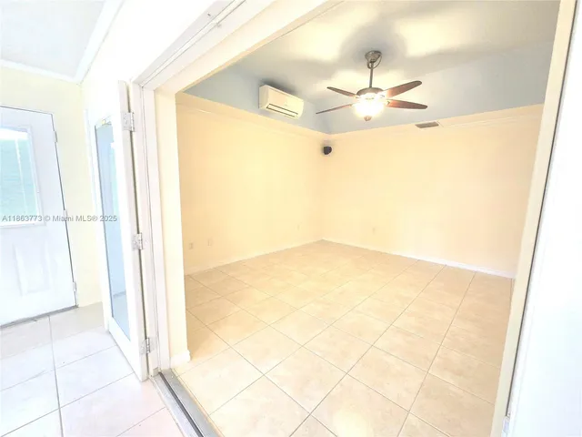 a view of an empty room with a window