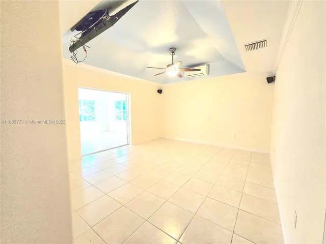 a view of a livingroom with a kitchen