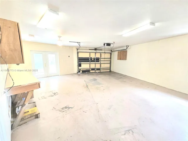 a view of a garden with large trees