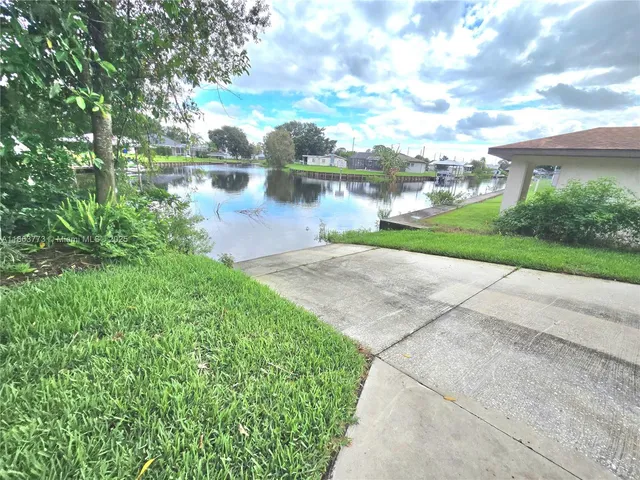 an aerial view of a house with a lake view