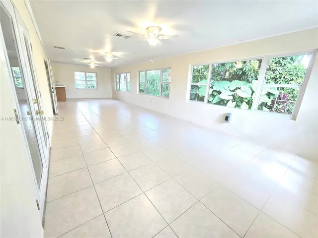 a view of a kitchen with a sink and cabinets