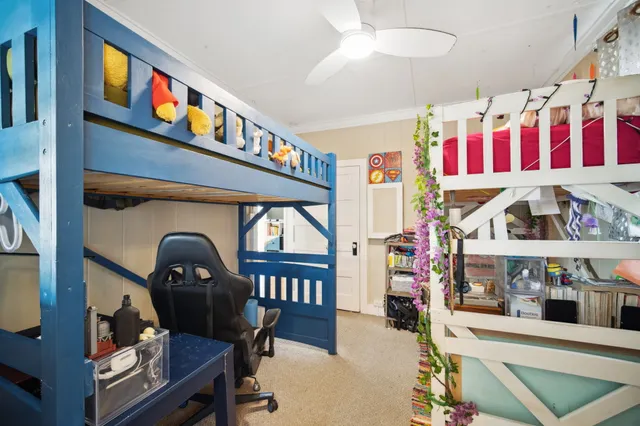 a living room with lots of furniture and a chandelier
