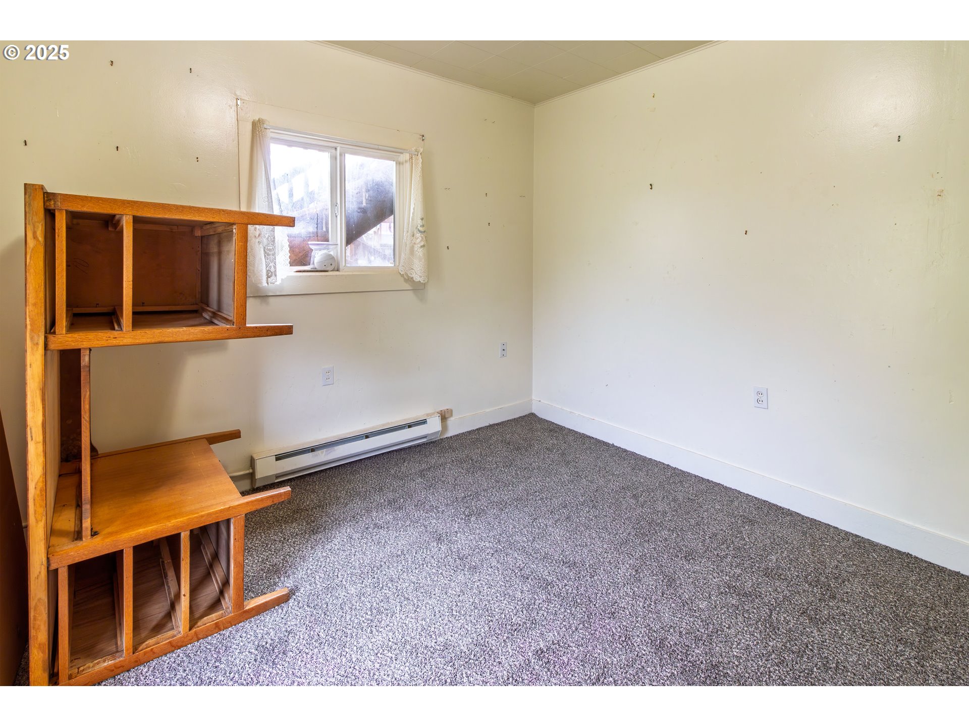 655 6th Street Myrtle Point, OR 97458 - Photo 13 of 31 a view of an empty room with a window