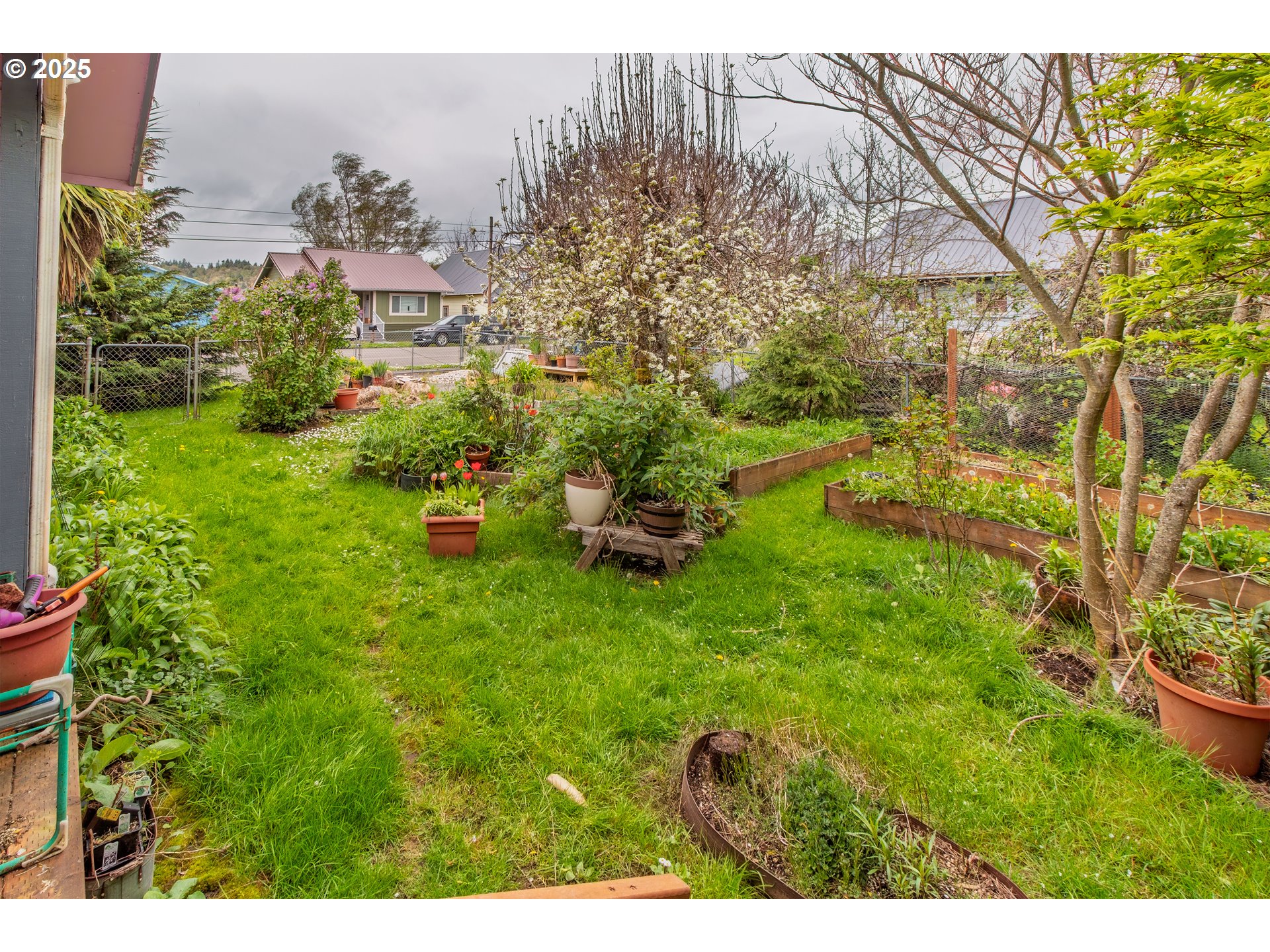 655 6th Street Myrtle Point, OR 97458 - Photo 19 of 31 a backyard of a building with an outdoor space and seating