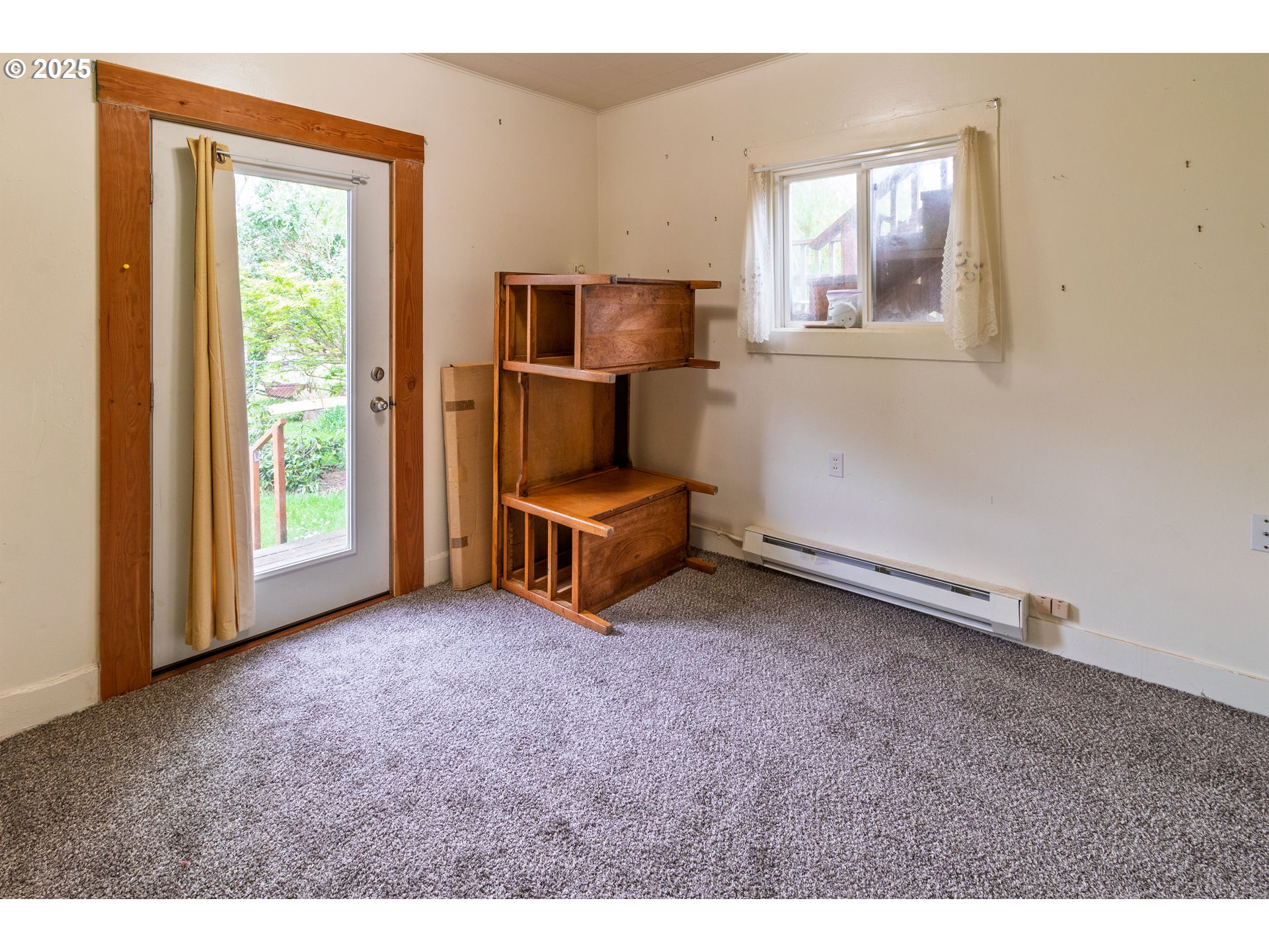 655 6th Street Myrtle Point, OR 97458 - Photo 31 of 31 a living room with furniture and a window