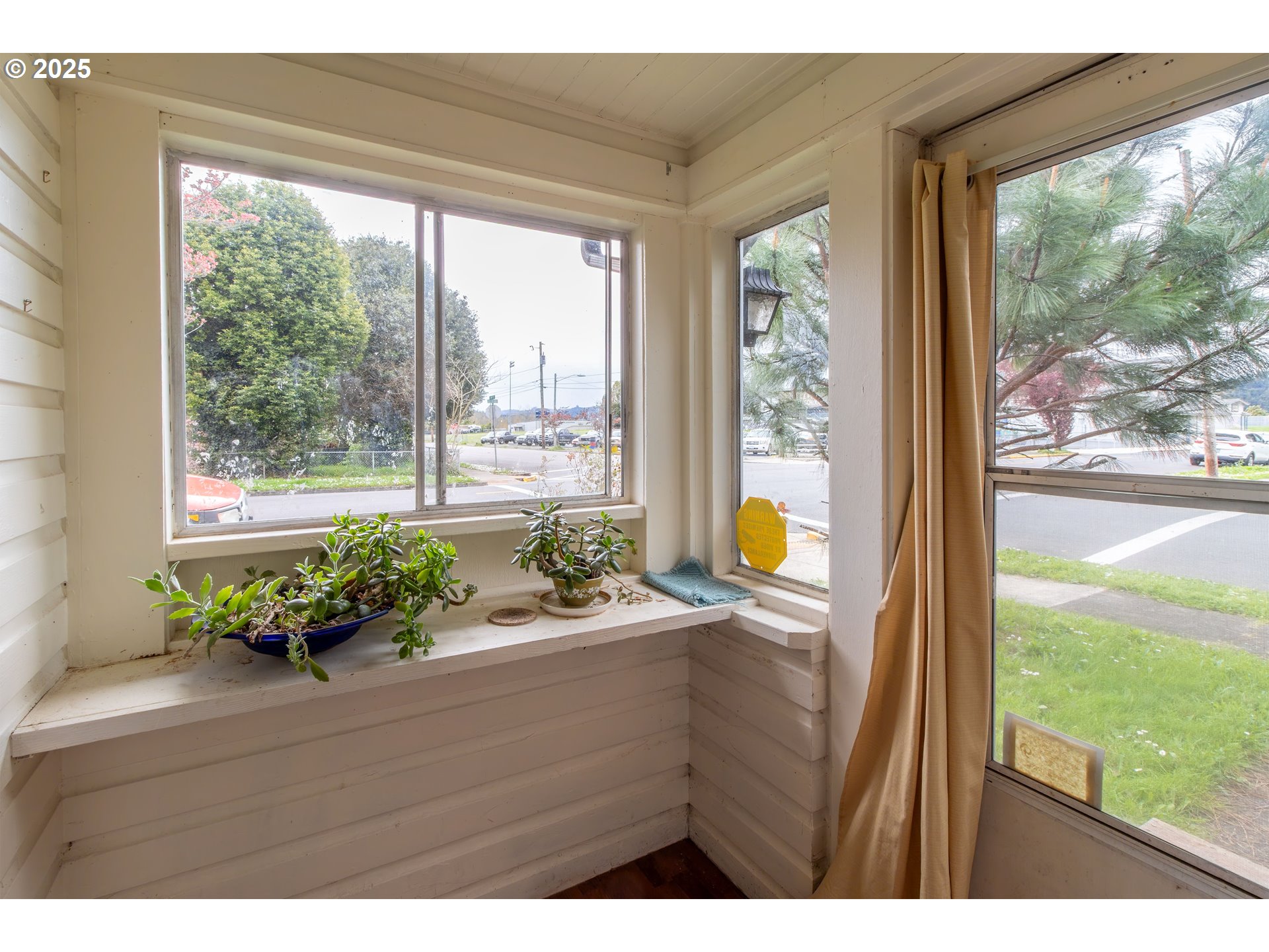 655 6th Street Myrtle Point, OR 97458 - Photo 4 of 31 a room with a large window and an outdoor space