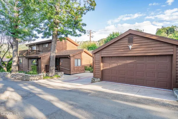 a front view of a house with a garage