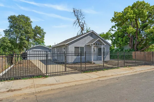 a view of a wrought iron fences in front of house