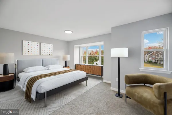 a bedroom with a bed lamp and window