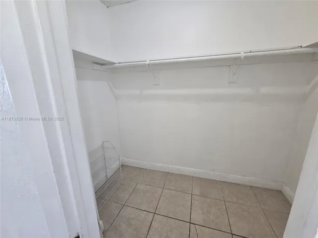 a white toilet sitting next to a sink