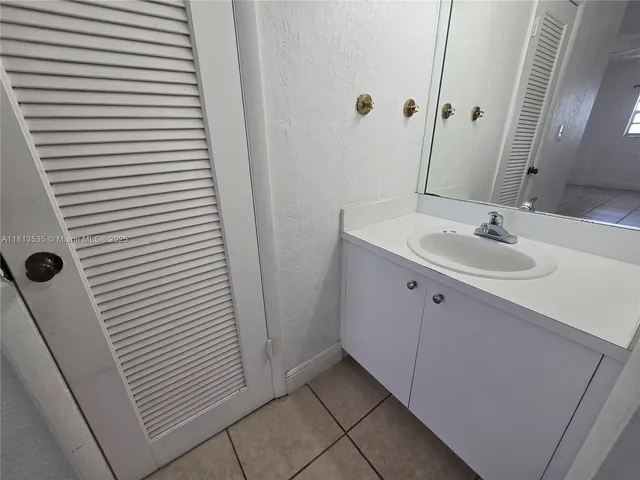a bathroom with a sink and toilet