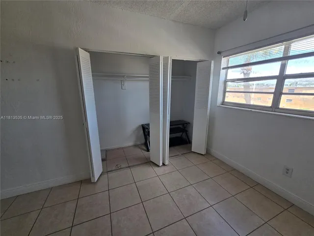 a view of parking garage with cars