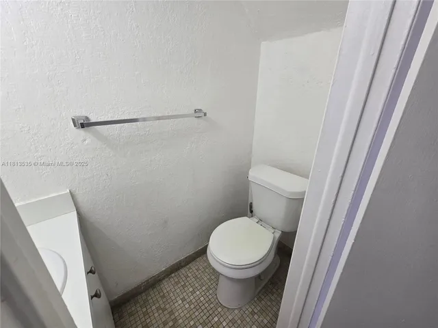 a view of a car parked in front of a house