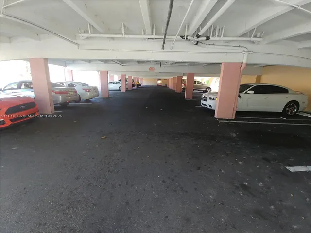 a bathroom with a sink and mirror with toilet