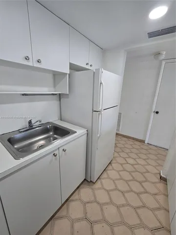 a view of an empty room and a window