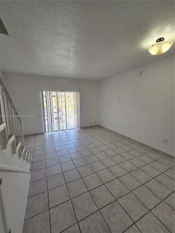 a bathroom with a toilet and shower