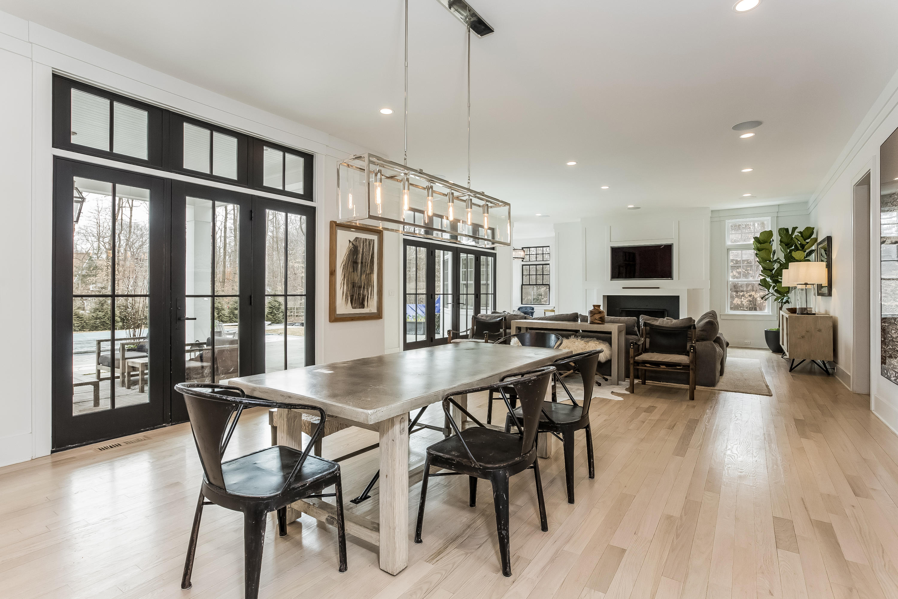 676 Hollow Tree Ridge Road Darien, CT 06820 - Photo 14 of 50 a view of a dining room with furniture window and wooden floor