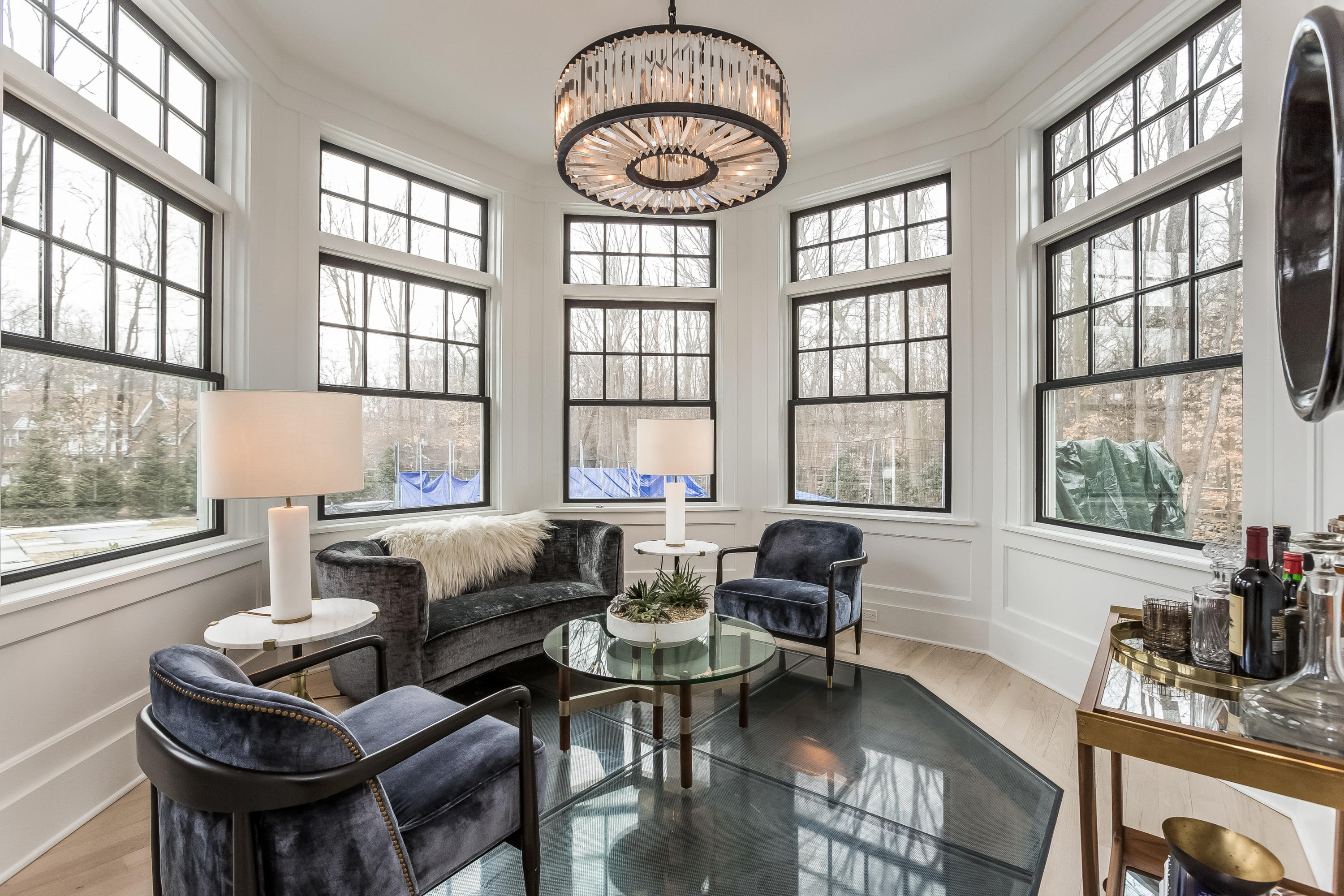 676 Hollow Tree Ridge Road Darien, CT 06820 - Photo 17 of 50 a living room with furniture a table and large windows