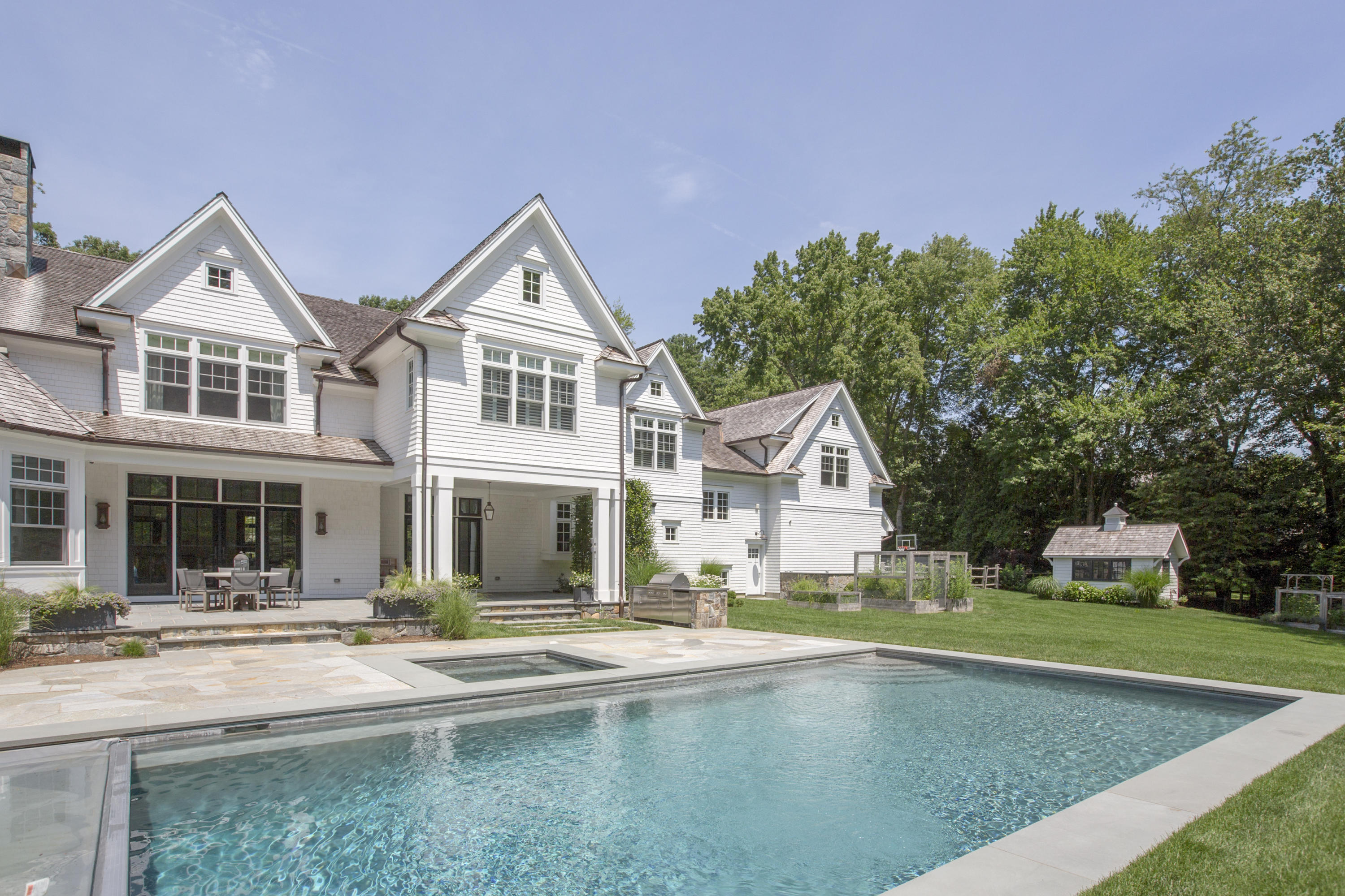 676 Hollow Tree Ridge Road Darien, CT 06820 - Photo 2 of 50 a front view of a house with a yard