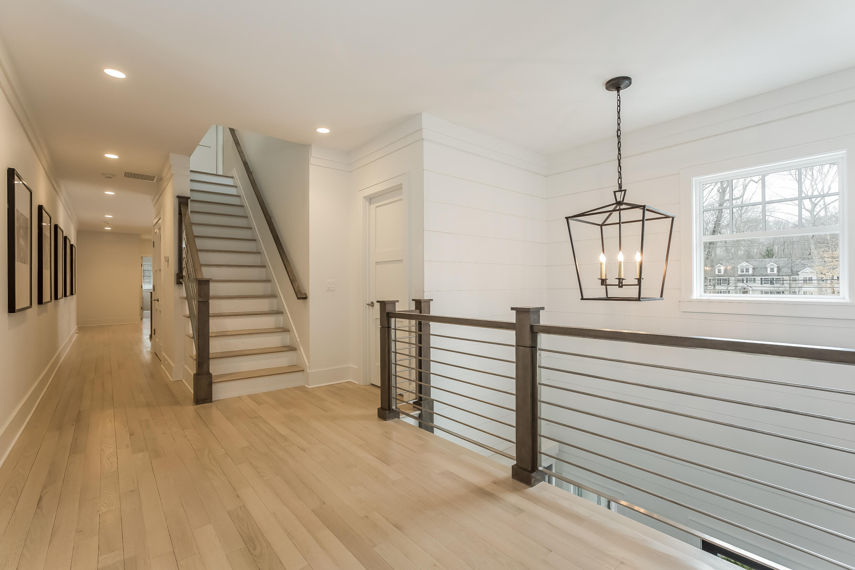 676 Hollow Tree Ridge Road Darien, CT 06820 - Photo 22 of 50 a view of entryway and hall with wooden floor