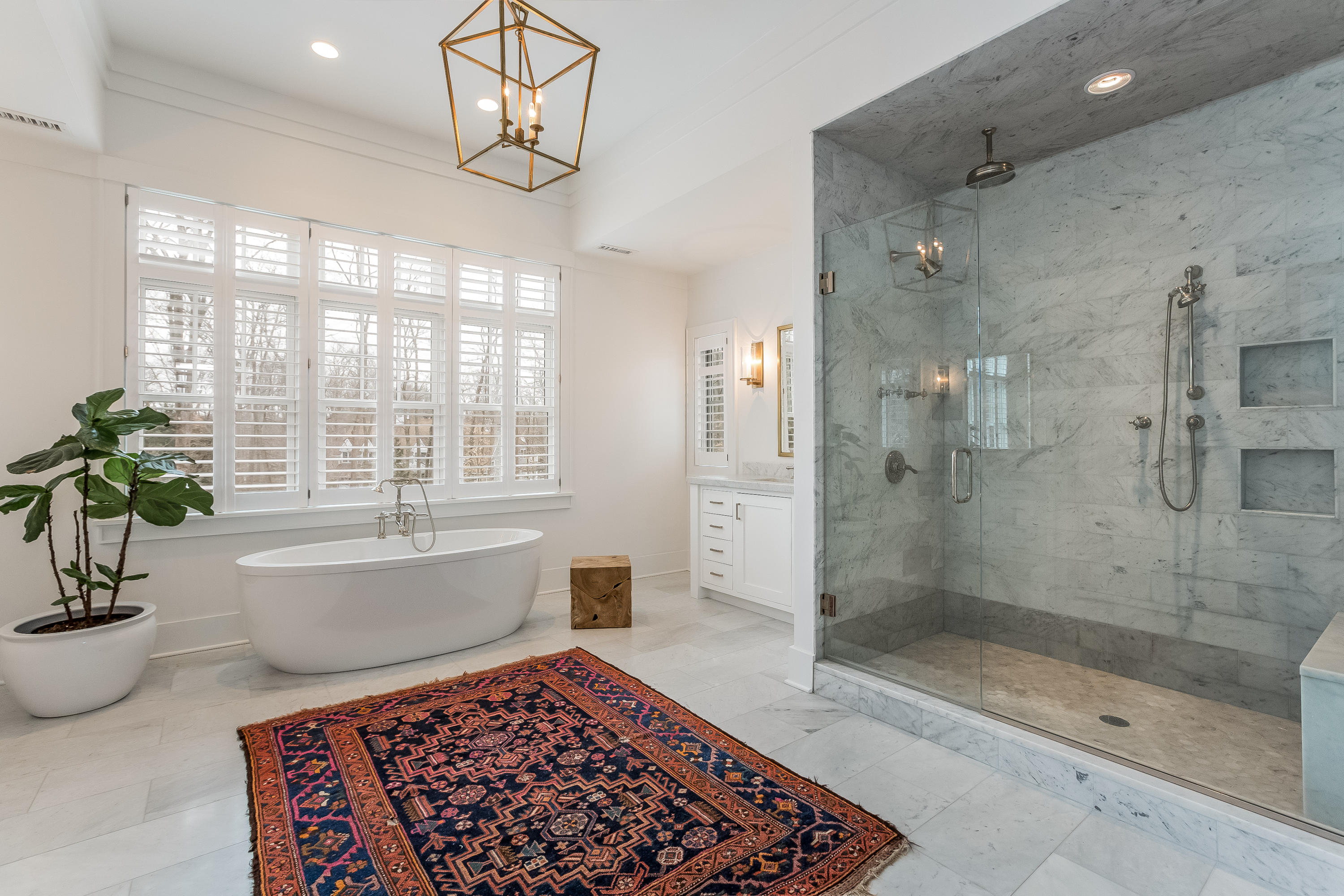 676 Hollow Tree Ridge Road Darien, CT 06820 - Photo 26 of 50 a bathroom with a bathtub and a shower