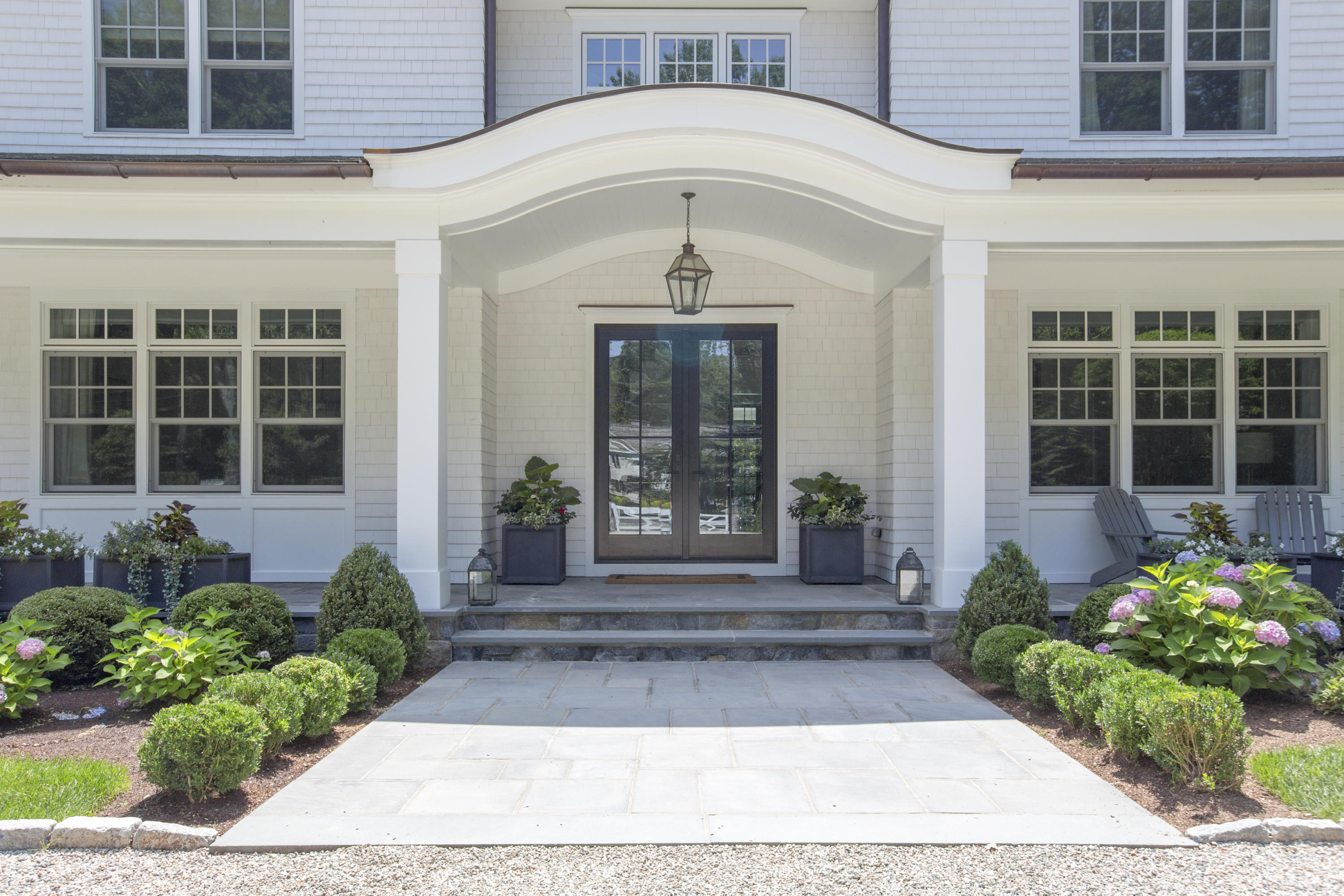 676 Hollow Tree Ridge Road Darien, CT 06820 - Photo 3 of 50 a front view of a house with a porch