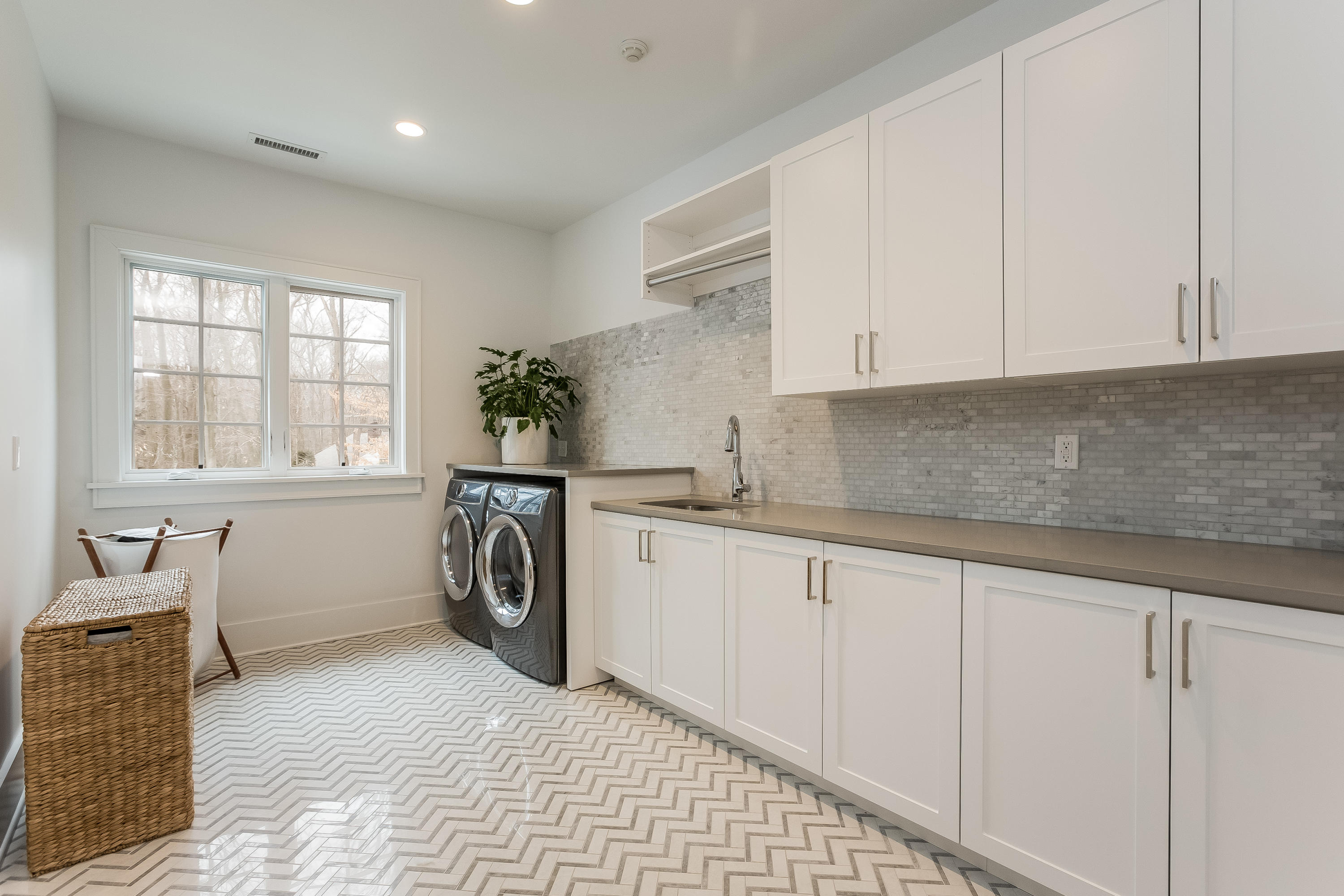 676 Hollow Tree Ridge Road Darien, CT 06820 - Photo 34 of 50 a utility room with sink dryer and washer