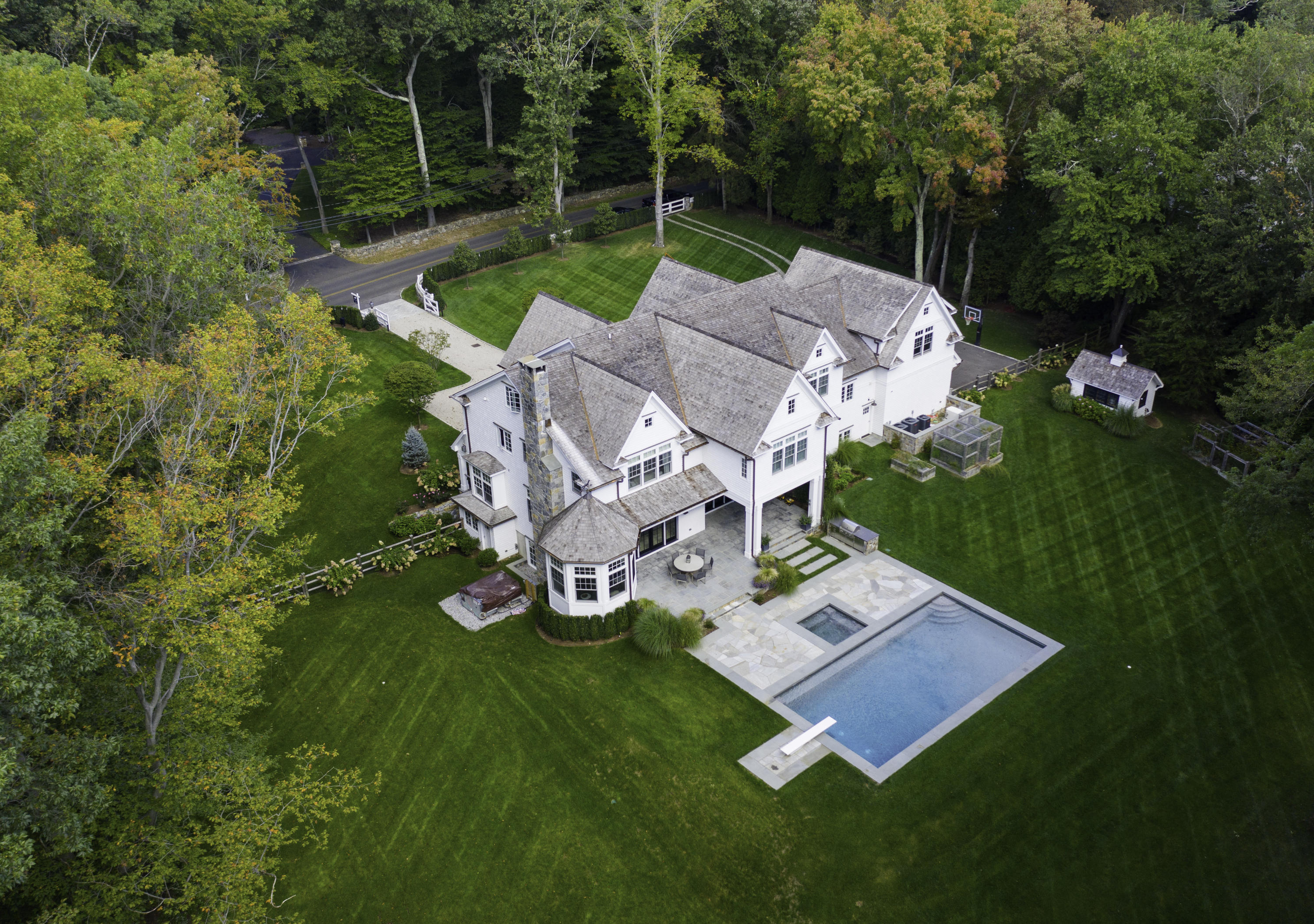 676 Hollow Tree Ridge Road Darien, CT 06820 - Photo 44 of 50 an aerial view of a house with swimming pool garden and patio