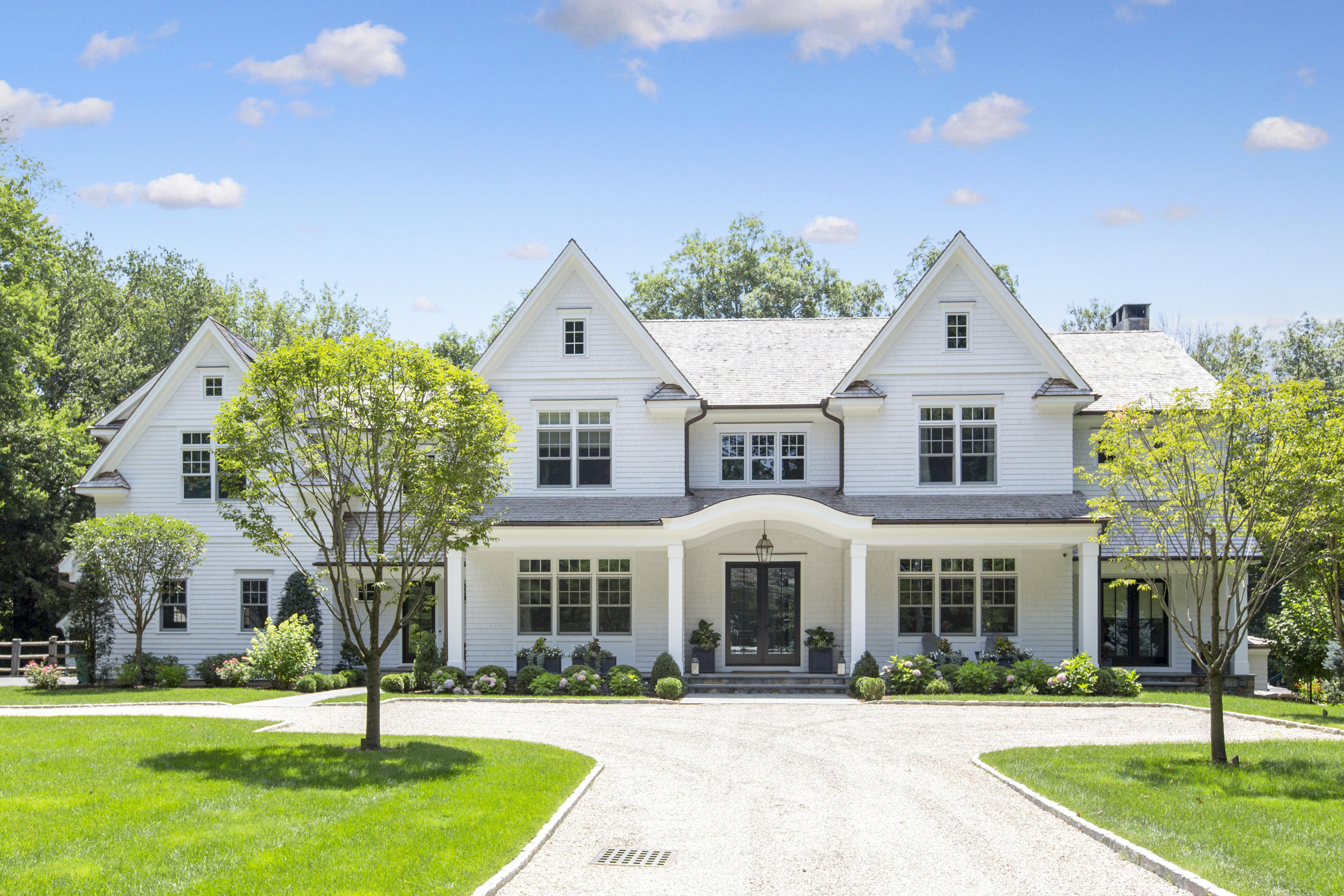 676 Hollow Tree Ridge Road Darien, CT 06820 - Photo 46 of 50 a view of an white house with a yard