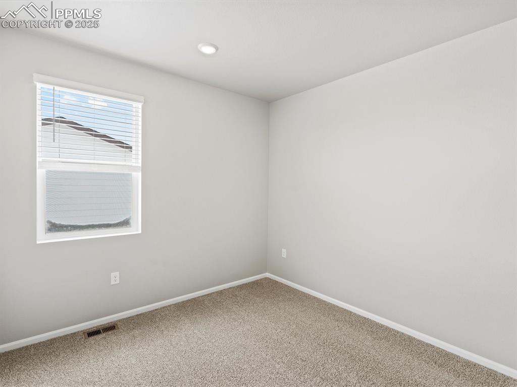 10434 Devoncove Drive Peyton, CO 80831 - Photo 12 of 24 an empty room with a window