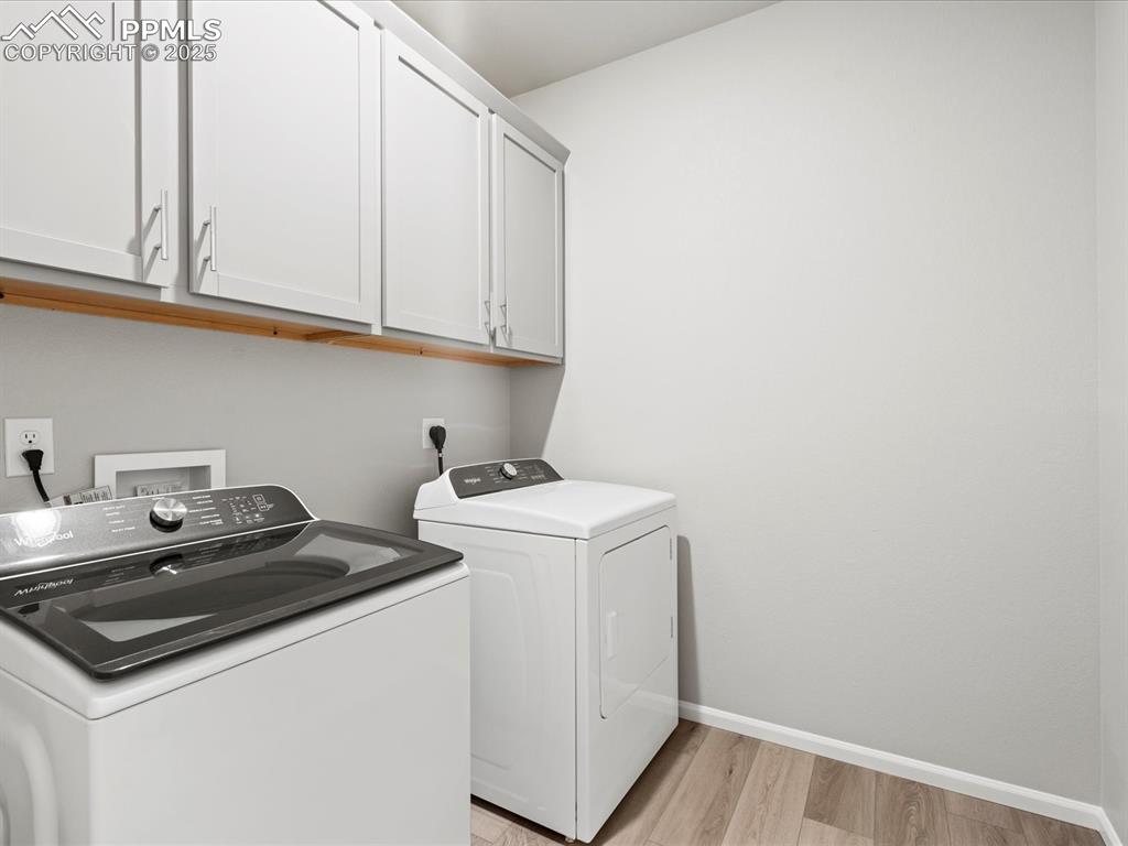 10434 Devoncove Drive Peyton, CO 80831 - Photo 15 of 24 a utility room with dryer and washer