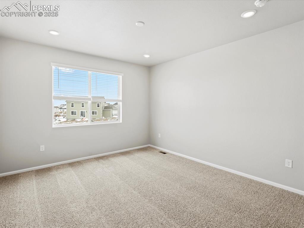 10434 Devoncove Drive Peyton, CO 80831 - Photo 16 of 24 an empty room with a window