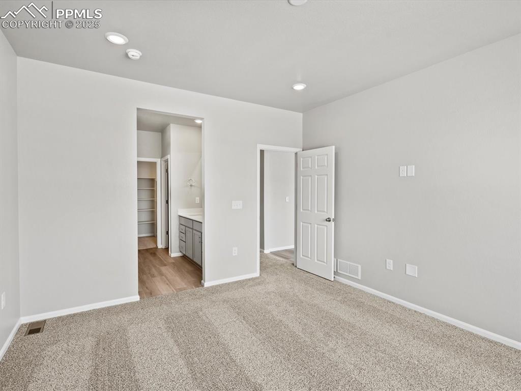 10434 Devoncove Drive Peyton, CO 80831 - Photo 17 of 24 an empty room with closet and a bathroom