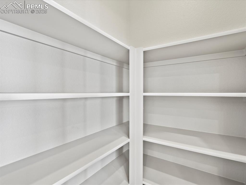 10434 Devoncove Drive Peyton, CO 80831 - Photo 7 of 24 a view of walk in closet with empty racks