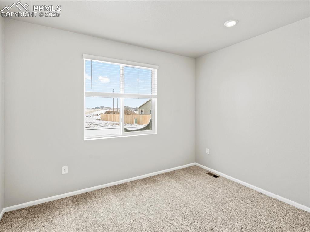 10434 Devoncove Drive Peyton, CO 80831 - Photo 10 of 24 an empty room with a window